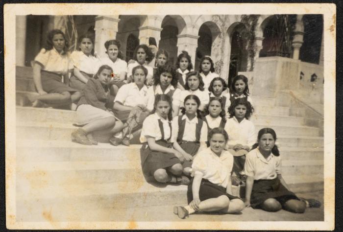 Female students of al-Aishiyya School in Nablus sitting on the school steps in the 1940s