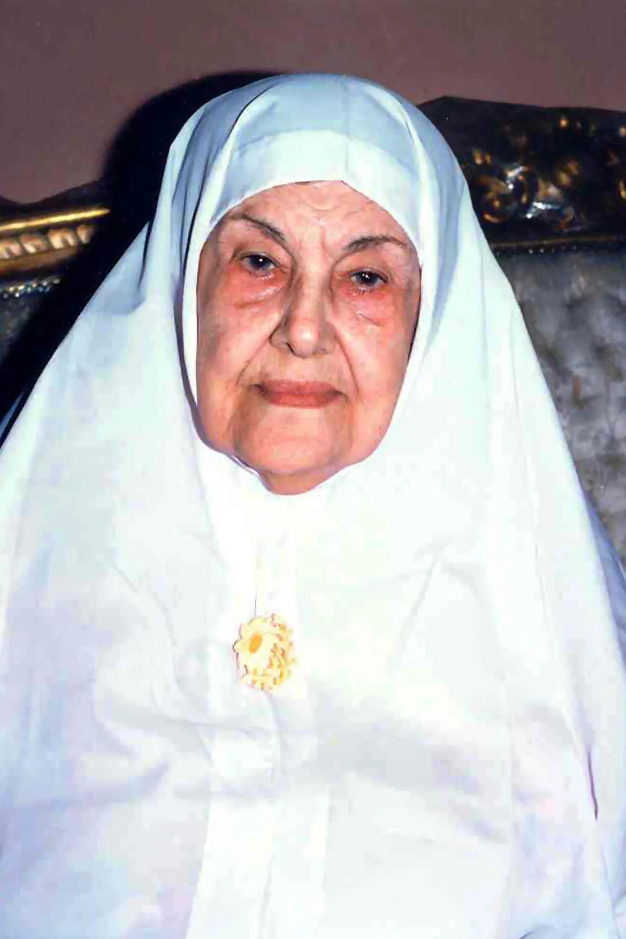 The Zahrat al-Uqhuwan emblem on Moheeba Khurshid’s chest at her home in Cairo (Source: Al Jazeera Net)